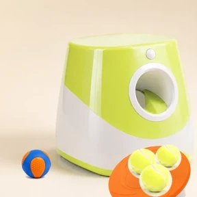 Launcher + flying disc + squeaky ball — the full kit